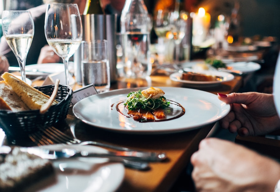A candlelit restaurant table with a plated dish