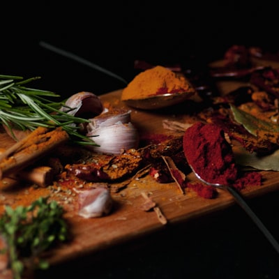 Whole and ground spices on a board